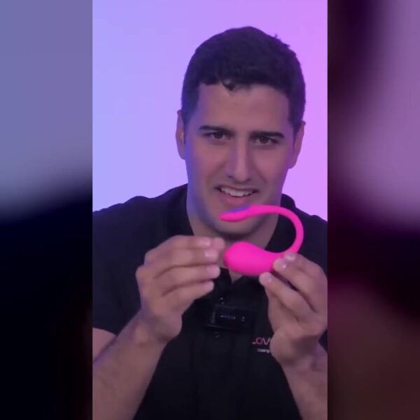 Lovense Lush 4 shown in a real hand to demonstrate flexible shape