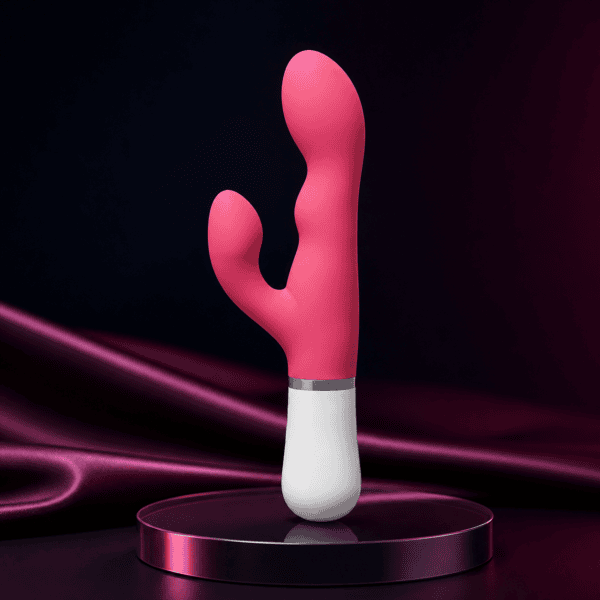 Lovense Nora pink and white rotating rabbit vibrator on a premium dark studio background